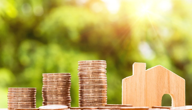 stack of coins and house showing an as is loan