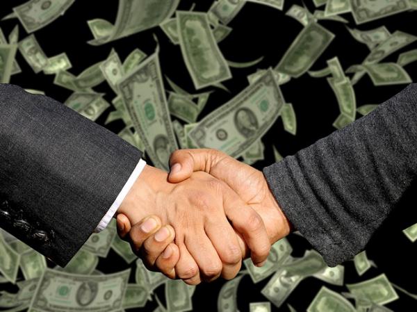 Real Estate Agent shaking hands with commercial lender